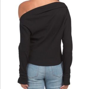 Brand new shirts in two different colors one black and one other color